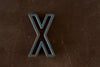 Vintage Industrial Letter "X" Black with Orange and Blue Paint, 2" tall (c.1940s) - thirdshift