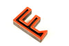 Vintage Industrial Letter "F" Black with Orange and Blue Paint, 2" tall (c.1940s) - thirdshift