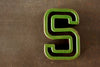 Vintage Industrial Letter "S" Black with Green and Orange Paint, 2" tall (c.1940s) - thirdshift