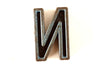 Vintage Industrial Letter "N" Black with Orange and Blue Paint, 2" tall (c.1940s) - thirdshift