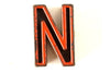 Vintage Industrial Letter "N" Black with Orange and Blue Paint, 2" tall (c.1940s) - thirdshift