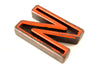 Vintage Industrial Letter "N" Black with Orange and Blue Paint, 2" tall (c.1940s) - thirdshift