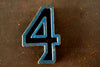 Vintage Industrial Number "4" Black with Blue and Orange Paint, 2" tall (c.1940s) - thirdshift