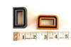 Vintage Industrial Letter "D" Black with Light Orange and Blue Paint, 2" tall (c.1940s) - thirdshift