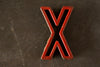 Vintage Industrial Letter "X" Black with Red and Blue Paint, 2" tall (c.1940s) - thirdshift