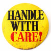 Vintage "Handle With Care" Metal Pinback Button, 6" diameter (c.1950s) - thirdshift