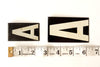 Vintage Industrial Metal Sign Letters in Original Wooden Box, 537 letters (c.1950s) - thirdshift