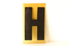 Vintage Industrial Marquee Sign Letter "H", Black on Yellow Flexible Plastic, 7" tall (c.1970s) - thirdshift