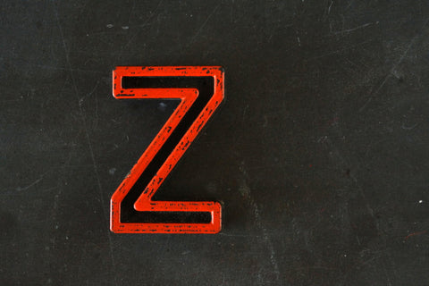 Vintage Industrial Letter "Z" Black with Orange and Blue Paint, 2" tall (c.1940s) - thirdshift
