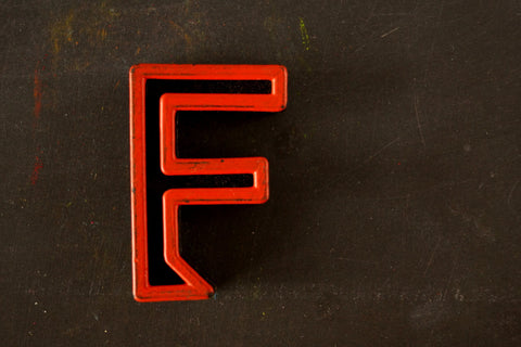 Vintage Industrial Letter "F" Black with Orange and Blue Paint, 2" tall (c.1940s) - thirdshift