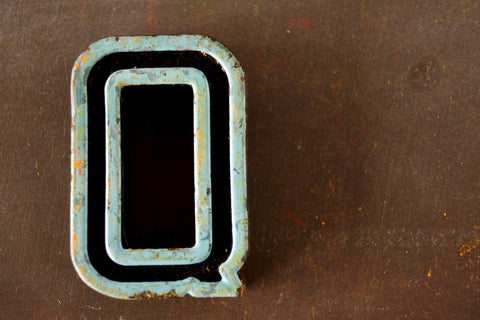Vintage Industrial Letter "Q" Black with Light Blue and Light Green Paint, 2" tall (c.1940s) - thirdshift