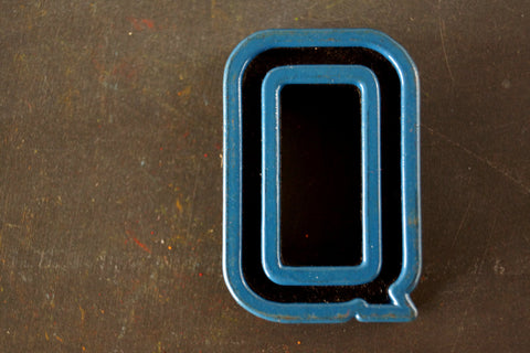 Vintage Industrial Letter "Q" Black with Blue and Orange Paint, 2" tall (c.1940s) - thirdshift
