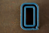 Vintage Industrial Letter "Q" Black with Blue and Orange Paint, 2" tall (c.1940s) - thirdshift
