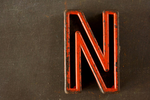 Vintage Industrial Letter "N" Black with Orange and Blue Paint, 2" tall (c.1940s) - thirdshift