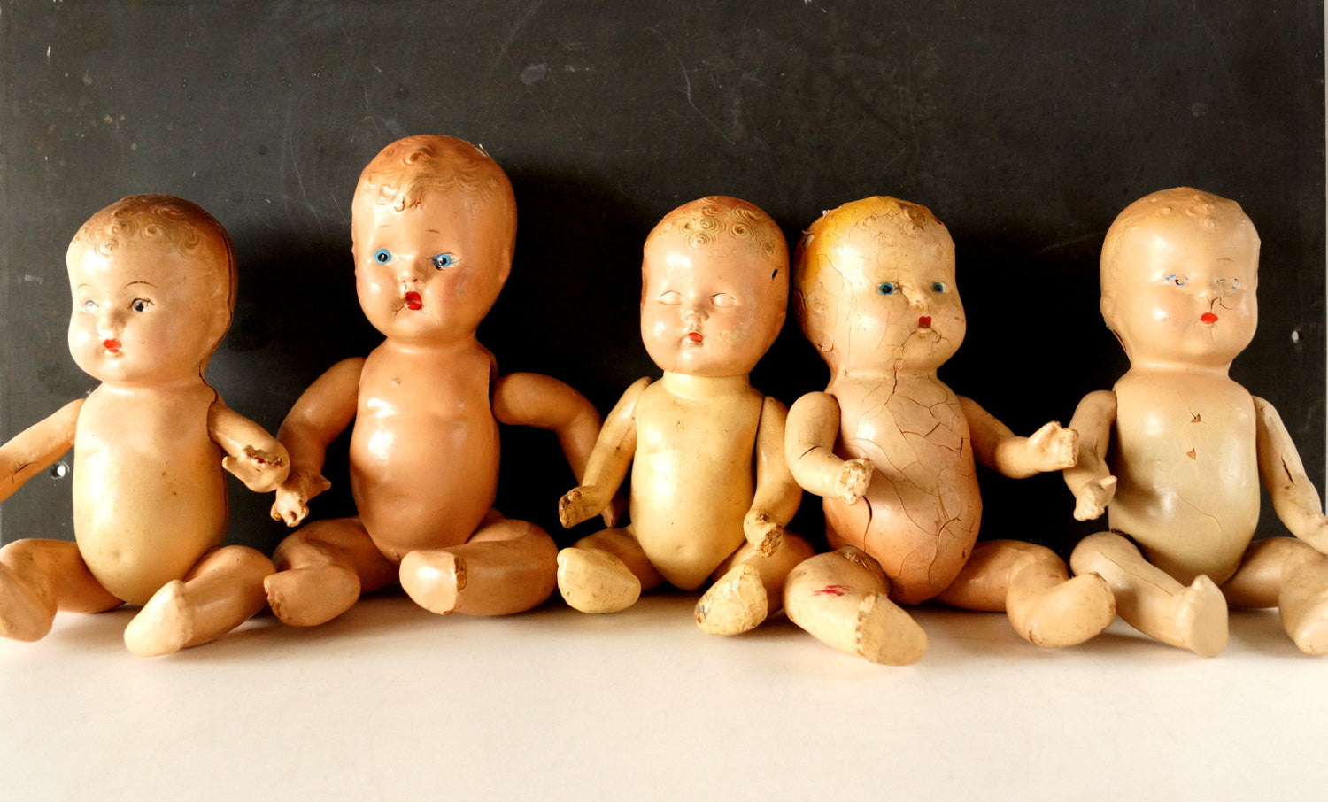 Vintage top composition dolls