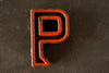 Vintage Industrial Letter "P" Black with Orange and Blue Paint, 2" tall (c.1940s) - thirdshift