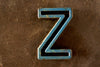 Vintage Industrial Letter "Z" Black with Blue and Orange Paint, 2" tall (c.1940s) - thirdshift