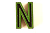 Vintage Industrial Letter "N" Black with Green and Red Paint, 2" tall (c.1940s) - thirdshift