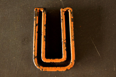 Vintage Industrial Letter "U" Black with Light Orange and Blue Paint, 2" tall (c.1940s) - thirdshift
