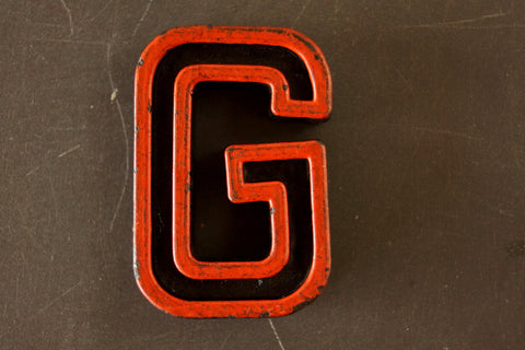 Vintage Industrial Letter "G" Black with Orange and Blue Paint, 2" tall (c.1940s) - thirdshift